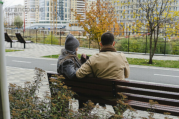 Man and woman sitting on bench