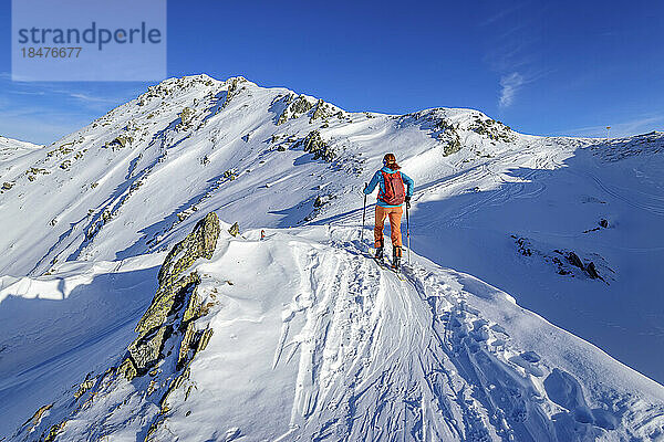Austria  Tyrol  Lone female skier in Tux Alps