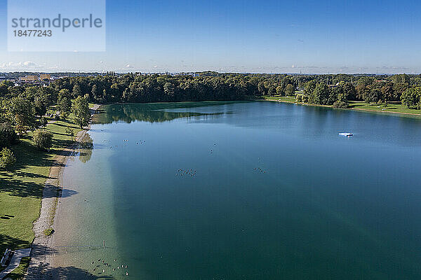 Germany  Bavaria  Karlsfeld  Aerial view of Karlsfelder See lake in sunshine