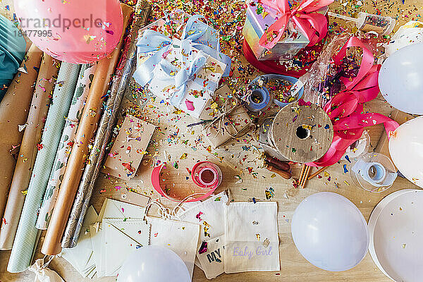 Various gift wrapping material and party decoration on desk