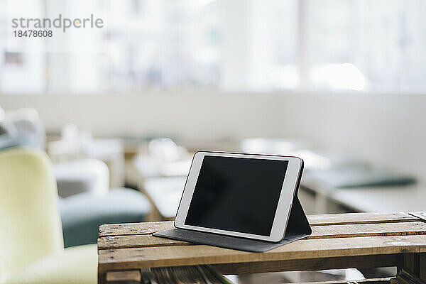 Tablet PC on table at cafe