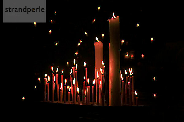 Studio shoot of red burning candles