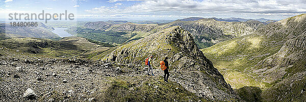 Hikers walking on mountain Pillar  Western Fells  Lake District  England