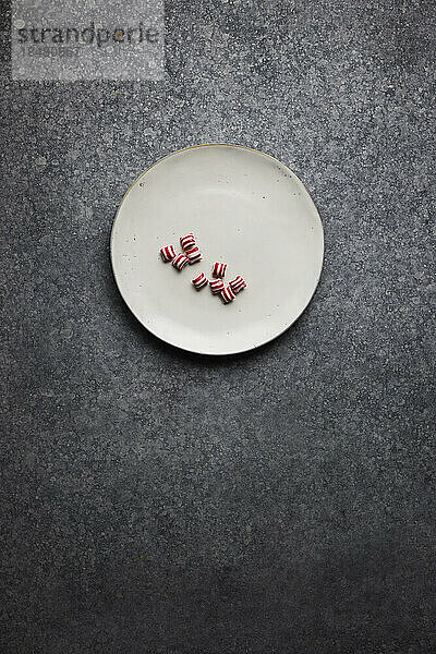 Studio shot of few pieces of candy on plate