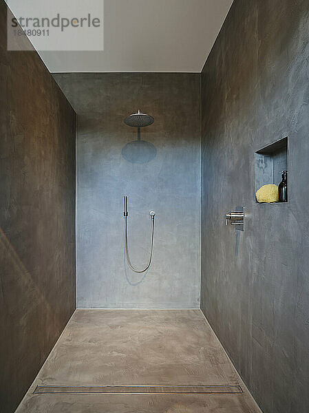 Interior of modern bathroom with shower in apartment
