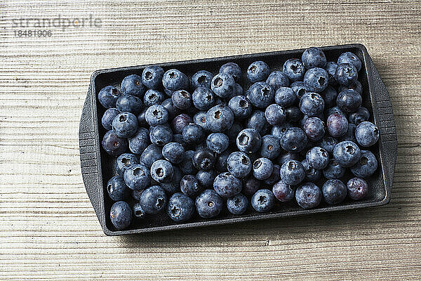 Tray with fresh ripe blueberries