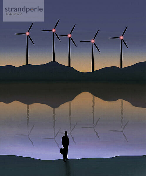 Illustration of businessman standing in front of lake at dusk with wind turbines in background