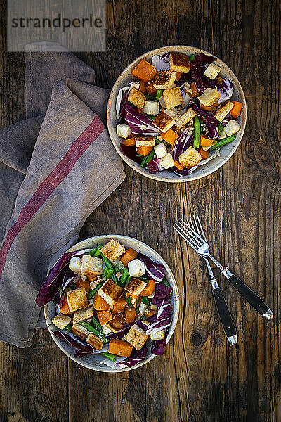 Two bowls of ready-to-eat vegan salad