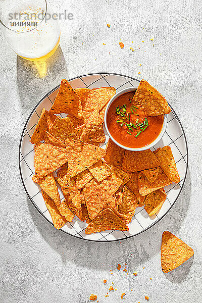 Nachos with tomato sauce served in plate