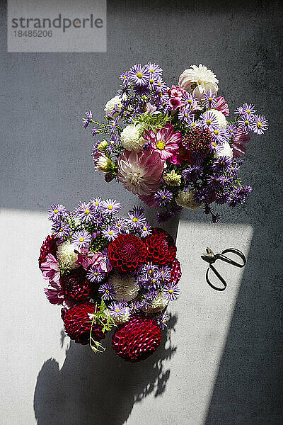 Studio shot of two bouquets of seasonal flowers