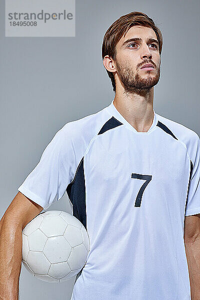 Soccer player studio portrait