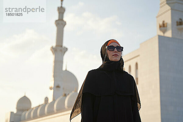 European woman is sightseeing in an Arab country in national clothes.