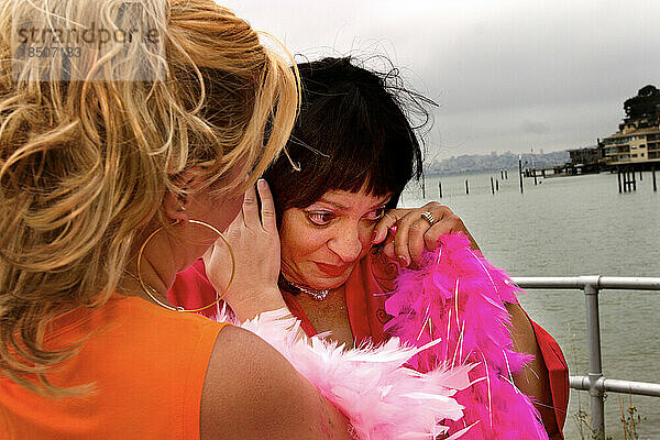 Woman wipes away tears during an emotional moment during the Avon Walk for Breast Cancer in San Francisco.