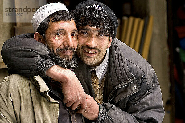Two men embrace in Kabul  Afghanistan.