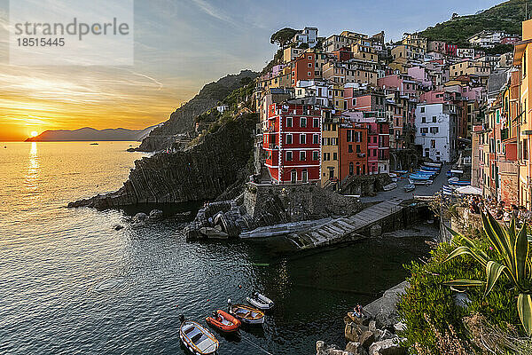 Italy  Liguria  Riomaggiore  Edge of coastal village along Cinque Terre at sunset