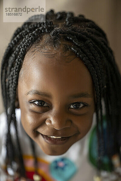 Smiling cute girl with braided hair