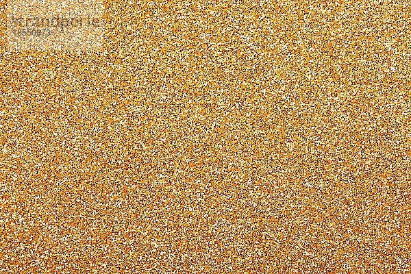 Golden Christmas Glittering Hintergrund. Urlaub Gold abstrakte Textur
