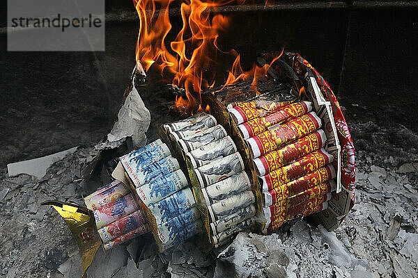 Mieu Ba Chua Xu temple (Temple of the Goddess Xu)  burning joss paper offerings  Chau Doc  Vietnam  Indochina  Southeast Asia  Asia