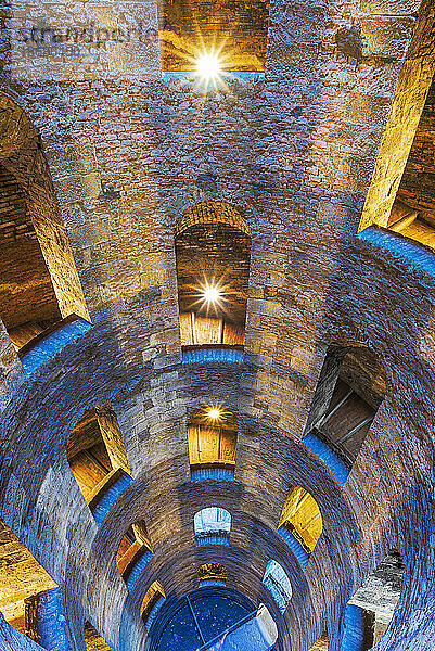 Illuminated view of the bottom of Saint Patrick's well with a spiral staircase  Orvieto  Terni province  Umbria region  Italy  Europe