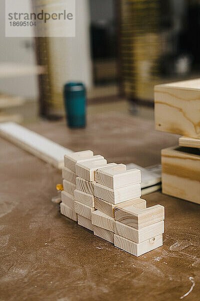 Wood blocks stacked on workbench in carpentry factory