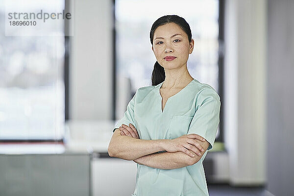 Portrait of confident nurse in scrubs