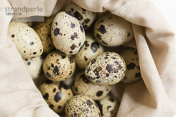 Fresh quail eggs in reusable bag
