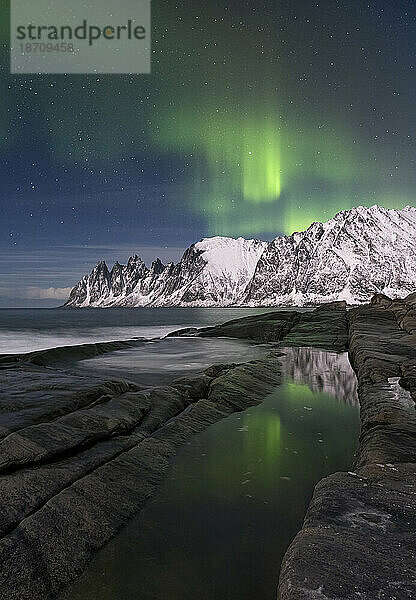 The Aurora Borealis (Northern Lights) over The Devils Jaw (Devils Teeth) (Okshornan mountains)  Tungeneset  Senja  Troms og Finnmark County  Norway  Scandinavia  Europe