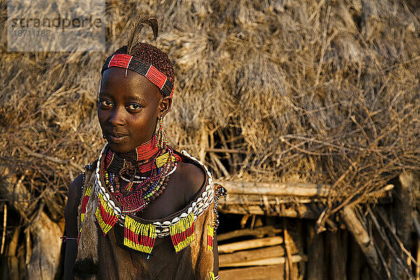 A portrait of a young woman in the Hamer Village in the remote Omo Valley of Ethiopia.