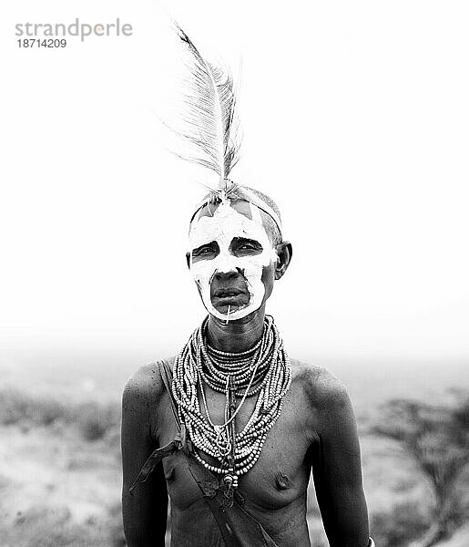 A portrait of a woman dressed in the traditional clothes and decoration in the Omo Valley  Ethiopia. (black and white)