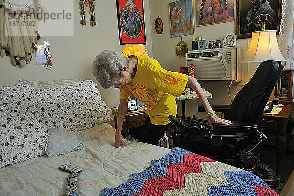 Portrait of older woman with a walker  inside her apartment in Easton  PA.
