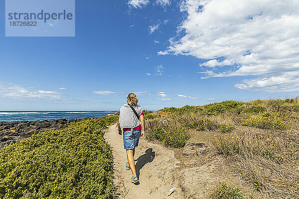Australia  Victoria  Port Fairy  Female tourist hiking in Port Fairy Coastline Protection Reserve