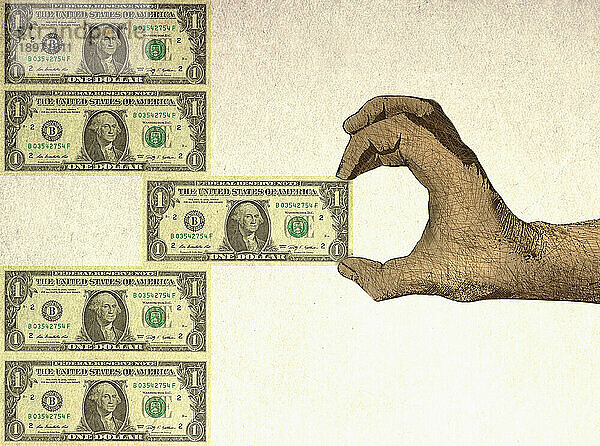 Hand entfernt Dollarschein aus der Mitte eines Stapels