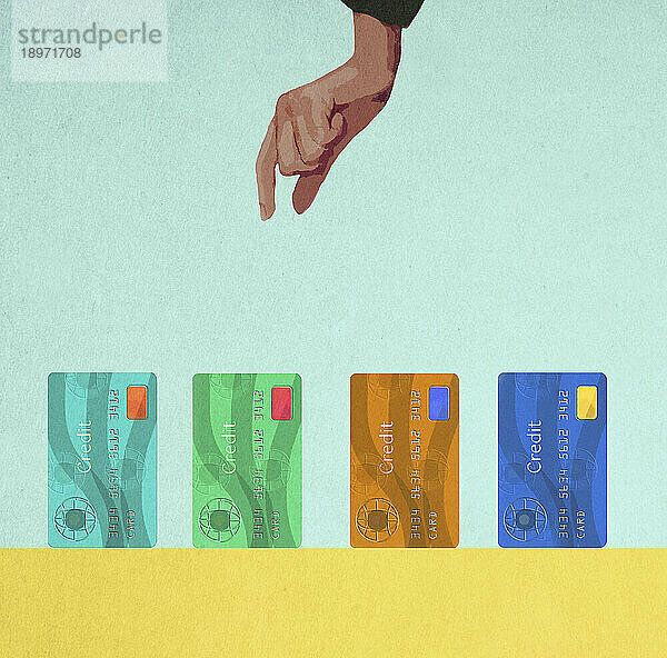 Hand wählt eine Kreditkarte aus