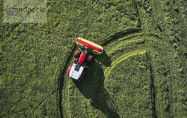 Tire tracks of tractor on grass in farm