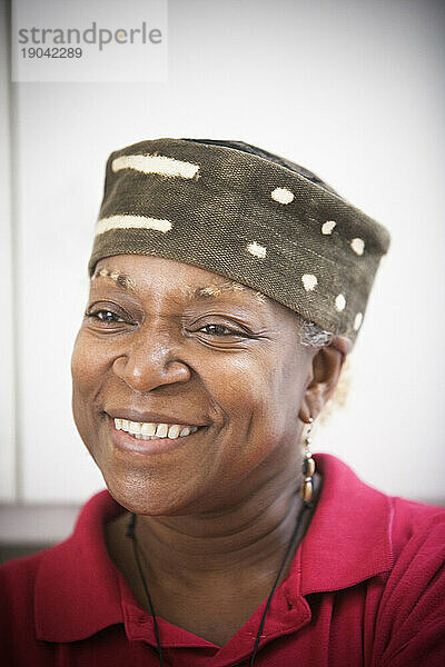 Portrait of a African American woman wearing a hat.