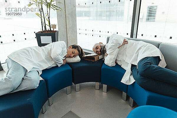 Doctors sleeping on sofa in hospital