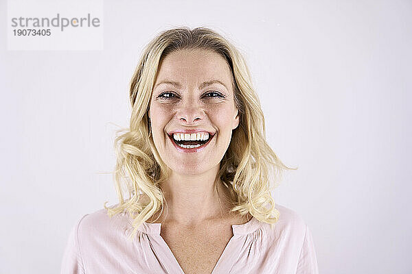 Portrait of laughing blond woman