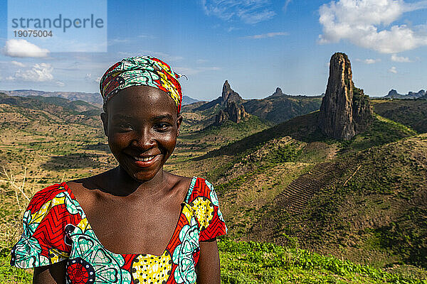 Kapsiki tribal girl in front of the lunar landscape of Rhumsiki   Rhumsiki  Mandara mountains  Far North province  Cameroon  Africa