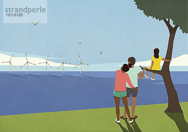 Ruhige Familie blickt auf Windkraftanlagen im sonnigen Ozean