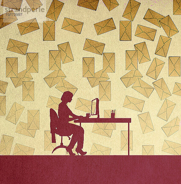 Silhouette of woman sitting at desk against large number of falling envelopes