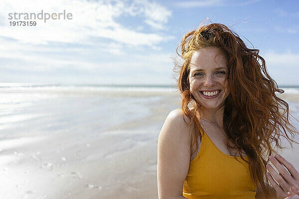 Happy woman enjoying vacation at beach