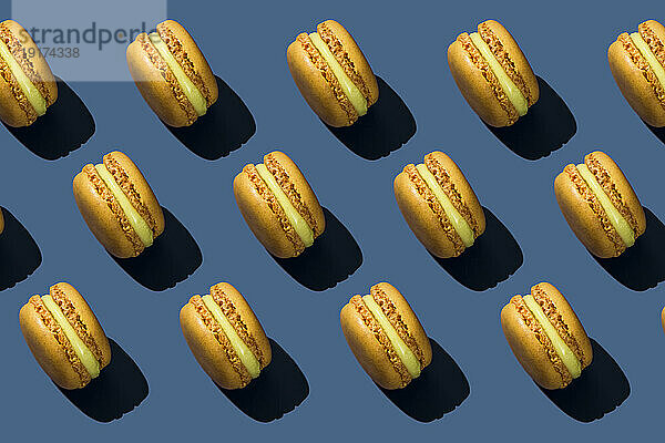 Yellow macaroons on blue background