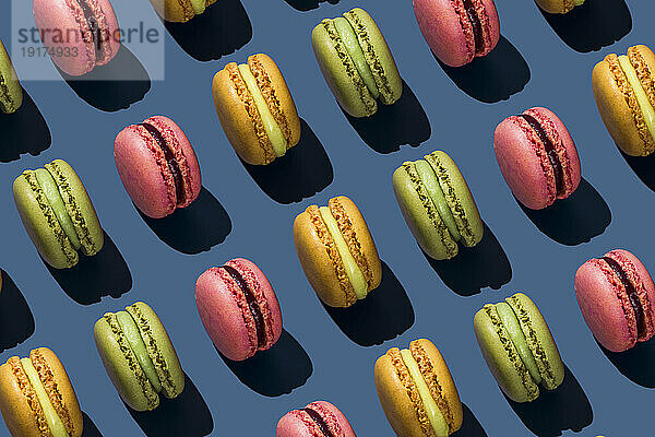 Multi colored macaroons on colored background