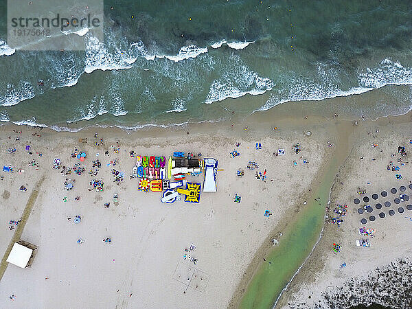 Spain  Valencian Community  Mil Palmeras  Aerial view of umbrellas on sandy beach