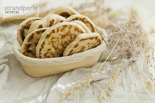 Homemade sourdough pita breads in basket