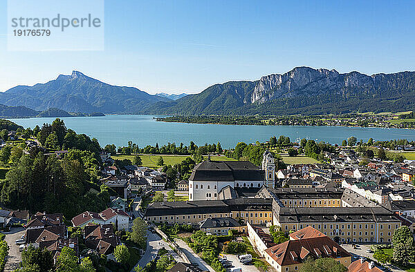 Austria  Upper Austria  Mondsee  Drone view of Mondsee Abbey with lake in background