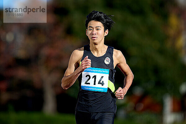 Japanese athlete running on track