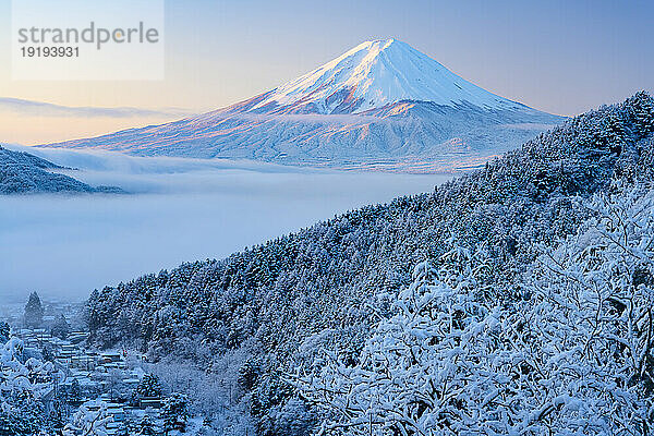 Snow scenery of Mount Fuji floating in the sea clouds in Yamanashi Prefecture
