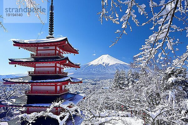 Snow covered Chuerito Pagoda at Arakurayama Sengen Park and Mount Fuji in Yamanashi Prefecture