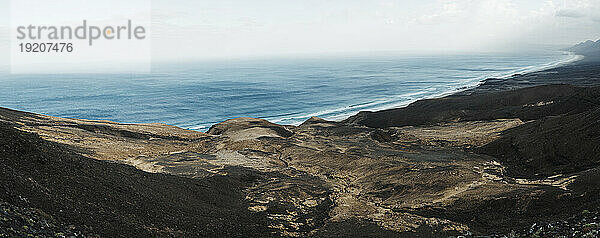 Fuerteventura island with volcanic landscape and sea